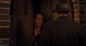 Movie still from “Carol” (2015), directed by Todd Haynes – A man and a woman are looking at each other; Medium shot, Over the shoulder angle