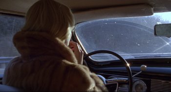 Movie still from “Carol” (2015), directed by Todd Haynes – A woman driving a car in the snow; Close Up shot, Over the shoulder angle