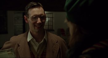 Movie still from “Carol” (2015), directed by Todd Haynes – A man wearing glasses talking to a woman wearing glasses; Close Up shot, Over the shoulder angle