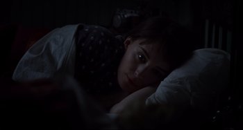 Movie still from “Carol” (2015), directed by Todd Haynes – A woman laying in a bed looking at the camera; Close Up shot, Overhead angle