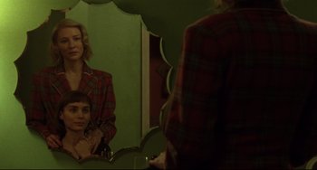 Movie still from “Carol” (2015), directed by Todd Haynes – A woman and a boy in front of a bathroom mirror; Medium shot, Over the shoulder angle