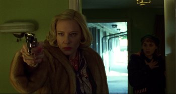 Movie still from “Carol” (2015), directed by Todd Haynes – A woman in a fur coat is standing in a hallway; Close Up shot, Low angle