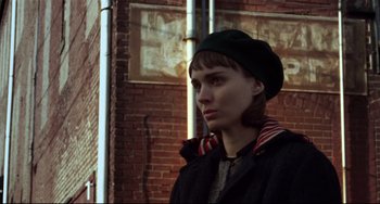 Movie still from “Carol” (2015), directed by Todd Haynes – A woman wearing a black hat and a black jacket; Close Up shot, Low angle