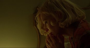 Movie still from “Carol” (2015), directed by Todd Haynes – A young girl looking at her reflection in a mirror; Close Up shot, Low angle