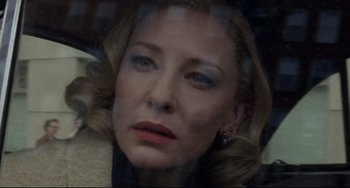 Movie still from “Carol” (2015), directed by Todd Haynes – A person wearing a suit and tie; Close Up shot, Low angle