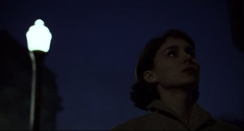 Movie still from “Carol” (2015), directed by Todd Haynes – A woman looking up at the sky at night; Close Up shot, Low angle