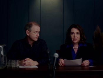 Movie still from “Casting JonBenet” (2017), directed by Kitty Green – A man and a woman sitting in front of microphones; Medium shot, Over the shoulder angle