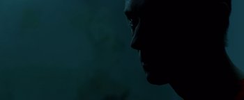 Movie still from “Casting JonBenet” (2017), directed by Kitty Green – A man's face is lit up by the glow of a candle; Extreme Close Up shot, Low angle