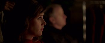 Movie still from “Casting JonBenet” (2017), directed by Kitty Green – A person looking at something in the dark; Close Up shot, Over the shoulder angle