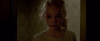 Movie still from “Casting JonBenet” (2017), directed by Kitty Green – A young girl is looking into the camera; Close Up shot, High angle