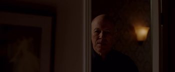 Movie still from “Casting JonBenet” (2017), directed by Kitty Green – An older man standing in front of a mirror; Close Up shot, Low angle