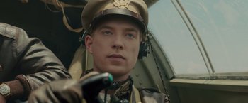 Movie still from “Unbroken” (2014), directed by Angelina Jolie – A person wearing a hat; Close Up shot, Low angle