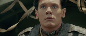 Movie still from “Unbroken” (2014), directed by Angelina Jolie – A person wearing a neck brace; Close Up shot, Low angle