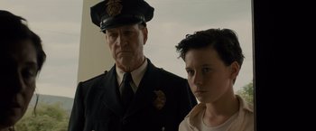 Movie still from “Unbroken” (2014), directed by Angelina Jolie – A man and a young boy in a uniform; Close Up shot, Low angle