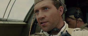 Movie still from “Unbroken” (2014), directed by Angelina Jolie – A person wearing a hat; Close Up shot, Low angle