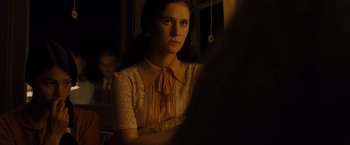 Movie still from “Unbroken” (2014), directed by Angelina Jolie – A young woman sitting in front of a mirror; Close Up shot, Over the shoulder angle