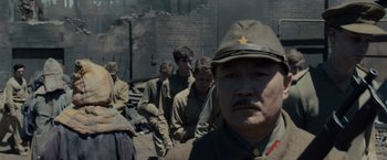 Movie still from “Unbroken” (2014), directed by Angelina Jolie – A group of men standing next to each other; Close Up shot, Over the shoulder angle