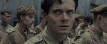 Movie still from “Unbroken” (2014), directed by Angelina Jolie – A group of young men standing next to each other; Close Up shot, Over the shoulder angle