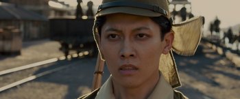 Movie still from “Unbroken” (2014), directed by Angelina Jolie – A person wearing a hat; Close Up shot, Low angle
