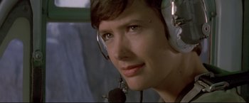 Movie still from “Cliffhanger” (1993), directed by Renny Harlin – A person wearing a headset; Close Up shot, Low angle