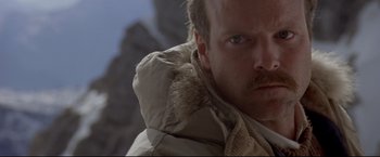Movie still from “Cliffhanger” (1993), directed by Renny Harlin – A person wearing a jacket; Close Up shot, Low angle