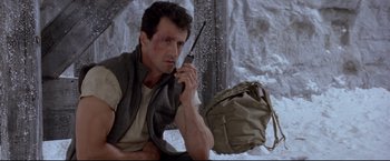 Movie still from “Cliffhanger” (1993), directed by Renny Harlin – Sylvester stallone in a scene from the movie ' rocky; Medium shot, Low angle