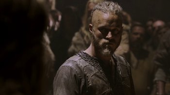 Movie still from “Vikings” (2013), created by Michael Hirst – A person with a beard; Close Up shot, Low angle