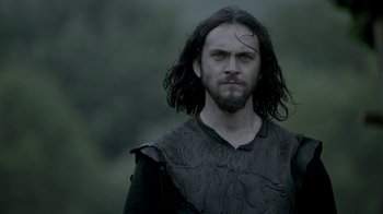 Movie still from “Vikings” (2013), created by Michael Hirst – A person with long hair; Close Up shot, Low angle