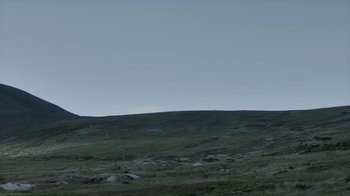 Movie still from “Vikings” (2013), created by Michael Hirst – A view of a grassy field with a sky background; Extreme Wide shot, Low angle