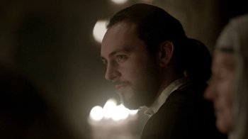 Movie still from “Vikings” (2013), created by Michael Hirst – A person wearing a suit and tie; Close Up shot, Low angle