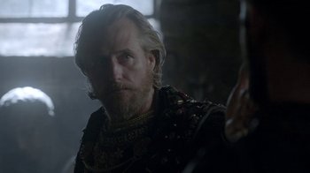 Movie still from “Vikings” (2013), created by Michael Hirst – A person with a beard; Close Up shot, Over the shoulder angle