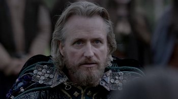 Movie still from “Vikings” (2013), created by Michael Hirst – A person with a beard; Close Up shot, Over the shoulder angle