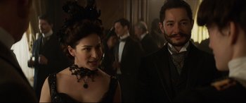 Movie still from “Colette” (2018), directed by Wash Westmoreland – A man and a woman standing next to each other; Close Up shot, Over the shoulder angle