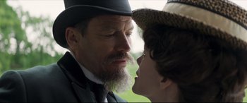 Movie still from “Colette” (2018), directed by Wash Westmoreland – A man and a woman face each other in front of a window; Close Up shot, Over the shoulder angle