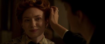Movie still from “Colette” (2018), directed by Wash Westmoreland – A woman is getting her hair done by a stylist; Close Up shot, Over the shoulder angle