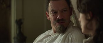 Movie still from “Colette” (2018), directed by Wash Westmoreland – A person with a beard; Close Up shot, Over the shoulder angle