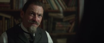 Movie still from “Colette” (2018), directed by Wash Westmoreland – A person with a beard; Close Up shot, Over the shoulder angle