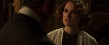 Movie still from “Colette” (2018), directed by Wash Westmoreland – A man and a woman are looking at one another; Close Up shot, Over the shoulder angle