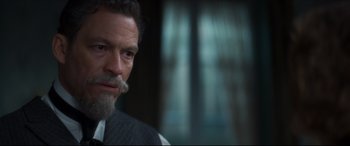 Movie still from “Colette” (2018), directed by Wash Westmoreland – A person wearing a suit and tie; Close Up shot, Over the shoulder angle