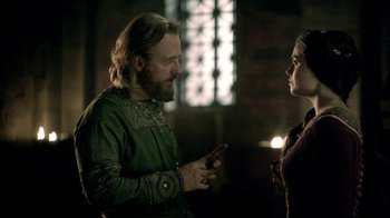 Movie still from “Vikings” (2013), created by Michael Hirst – A man and a woman are talking in a room; Medium shot, Over the shoulder angle
