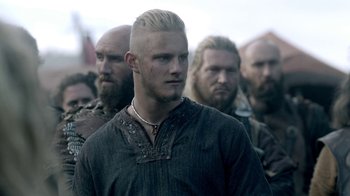 Movie still from “Vikings” (2013), created by Michael Hirst – A group of men standing next to each other; Close Up shot, Low angle