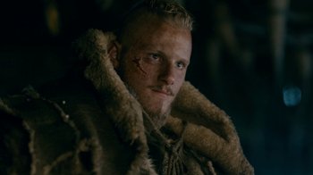 Movie still from “Vikings” (2013), created by Michael Hirst – A person wearing a fur coat; Close Up shot, Low angle