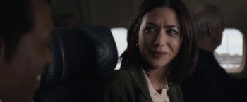 Movie still from “Come Sunday” (2018), directed by Joshua Marston – A person sitting in a car seat; Close Up shot, Over the shoulder angle