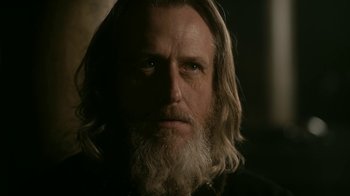 Movie still from “Vikings” (2013), created by Michael Hirst – A person with long hair and a beard; Close Up shot, Low angle