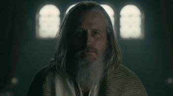 Movie still from “Vikings” (2013), created by Michael Hirst – A man with long white hair and a long beard; Close Up shot, Low angle