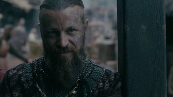 Movie still from “Vikings” (2013), created by Michael Hirst – A person with a beard; Close Up shot, Over the shoulder angle