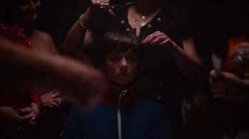Movie still from “Copenhagen Cowboy” (2022), created by Nicolas Winding Refn – A woman getting her hair cut by a stylist; Close Up shot, Over the shoulder angle