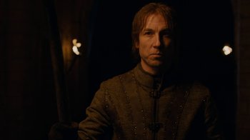 Movie still from “Game of Thrones” (2011), created by D.B. Weiss – A person wearing a jacket; Close Up shot, Low angle