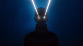 Movie still from “Copenhagen Cowboy” (2022), created by Nicolas Winding Refn – A man with two lights in his head; Extreme Close Up shot, Low angle