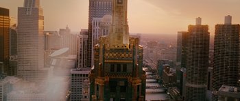 Movie still from “Wanted” (2008), directed by Timur Bekmambetov – An aerial view of a city with a clock tower; Extreme Wide shot, Overhead angle